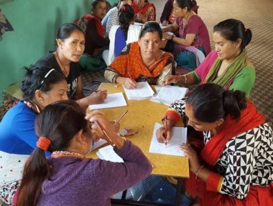 group of older women learning to read and write