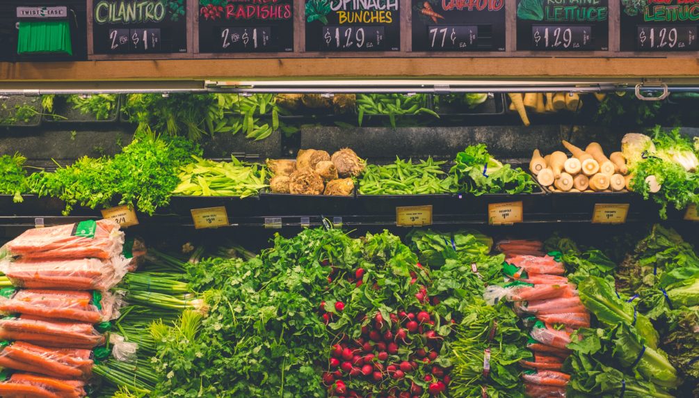 market with various greens and veggies