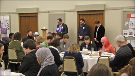 group of religiously diverse people praying together